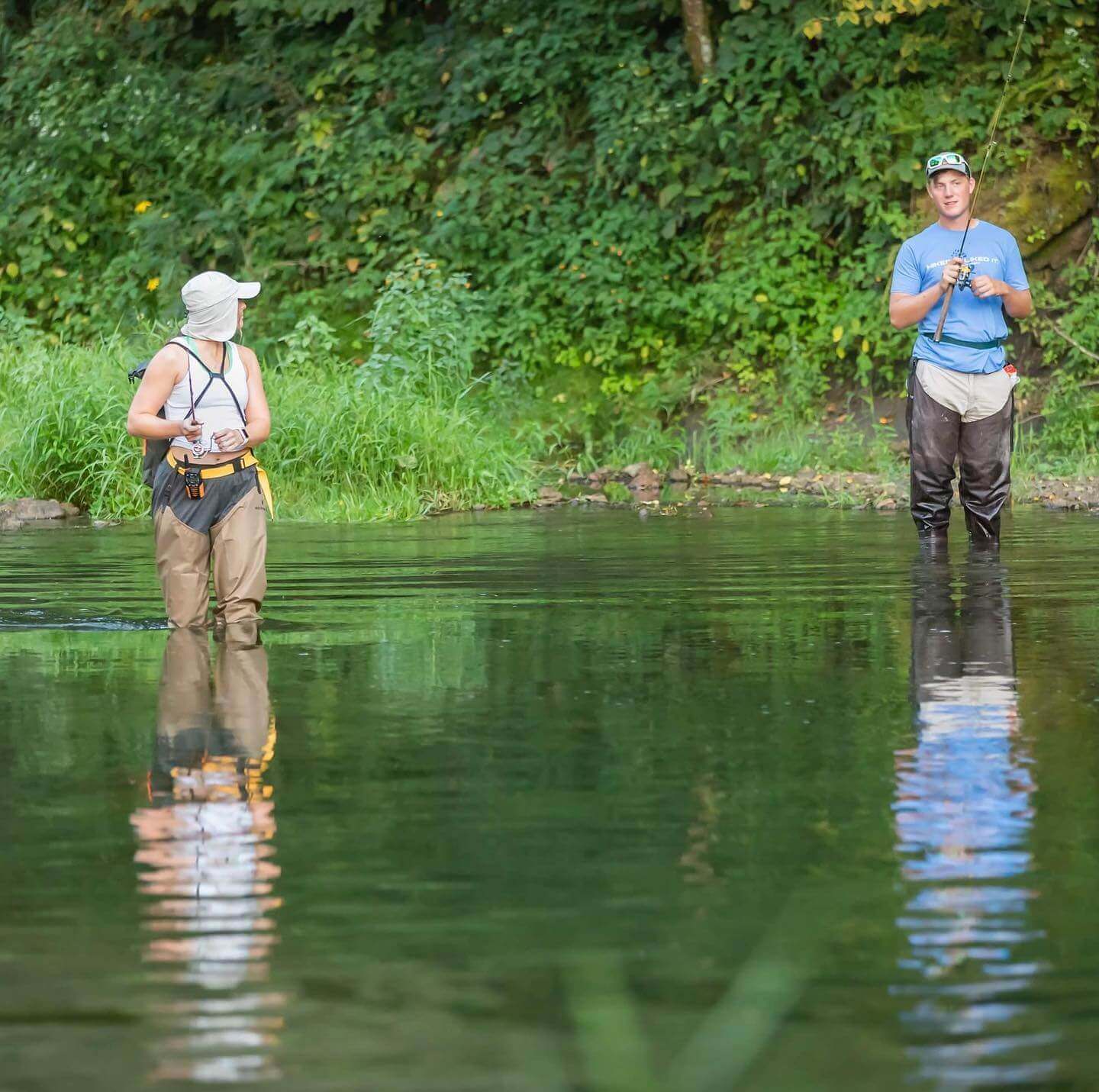 People fishing in creek